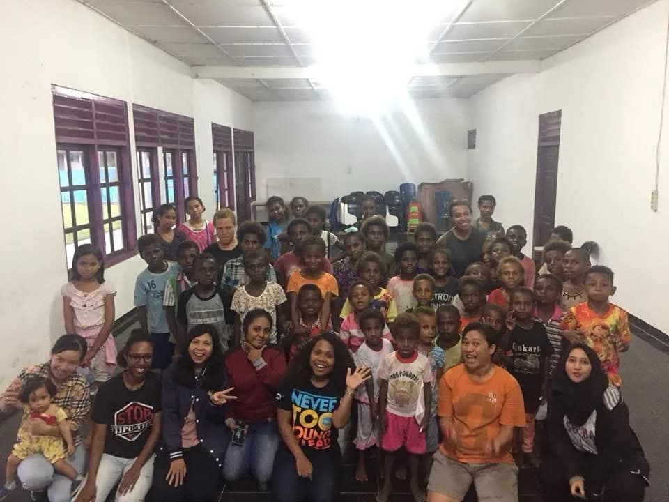 Community gathering representing Papua roots and shared purpose